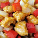 Crispy battered chicken with onions and red peppers in sweet & sour sauce.